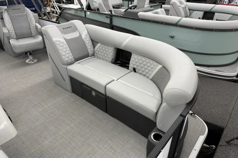 Slide: The Image of 2026 Crest Conquest 210 SLC boat interior with luxurious seating and modern design. - 3