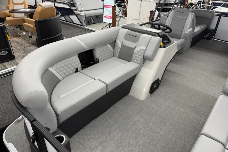 Slide: The Image of 2026 Crest Conquest 210 SLC pontoon boat interior with luxurious seating and modern design. - 4