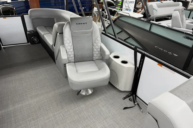 Slide: The Image of 2026 Crest Conquest 210 SLC boat interior with luxurious seating and modern design. - 5