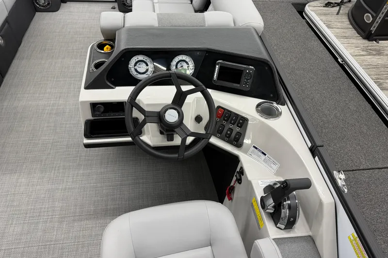 Slide: The Image of Steering console of 2026 Crest Conquest 210 SLC boat with modern controls and gauges. - 7
