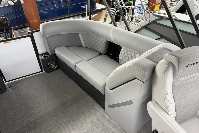 Slide: The Image of Luxurious seating on the 2026 Crest Conquest 210 SLC pontoon boat, featuring elegant upholstery. - 8