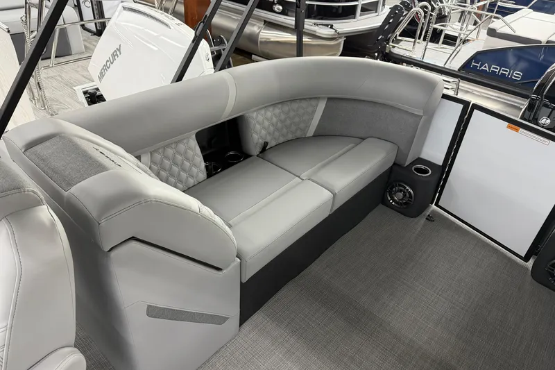 Slide: The Image of Luxurious seating on the 2026 Crest Conquest 210 SLC pontoon boat, featuring elegant gray upholstery. - 9