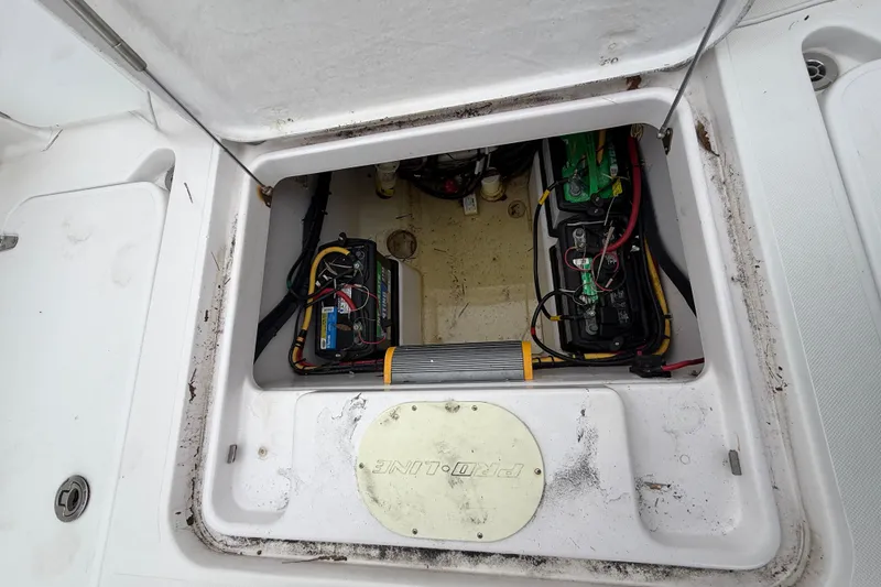 Slide: The Image of Battery compartment of a 2017 Pro-Line 29 Grand Sport boat, showing wiring and components. - 16
