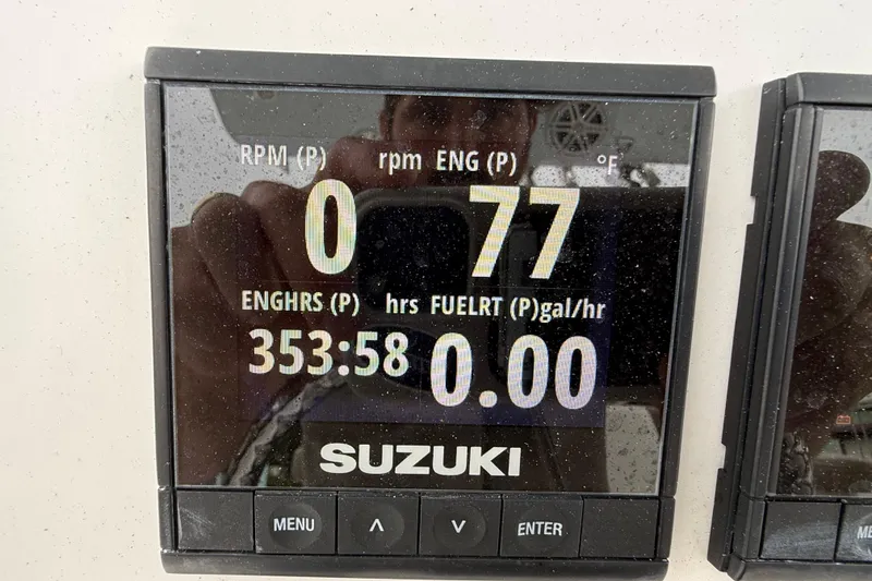 Slide: The Image of Suzuki engine display on 2017 Pro-Line 29 Grand Sport showing RPM and engine hours. - 25