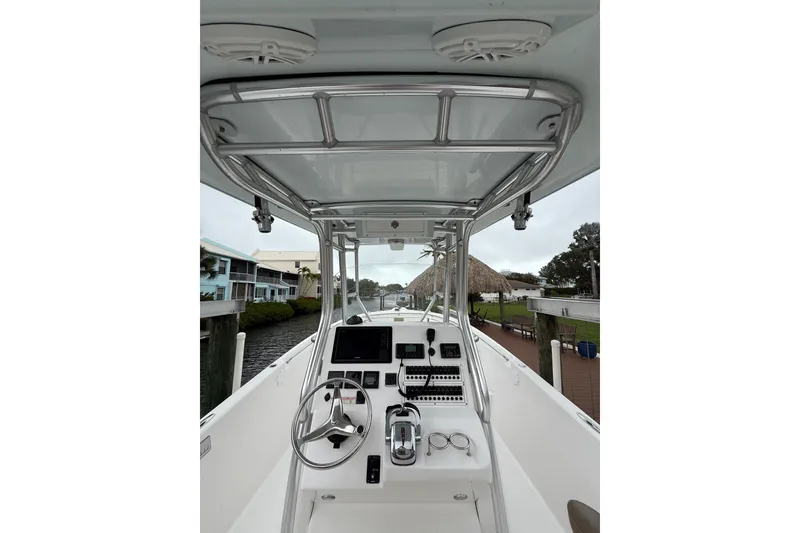 Slide: The Image of 2017 Pro-Line 29 Grand Sport boat interior with steering wheel and control panel. - 5