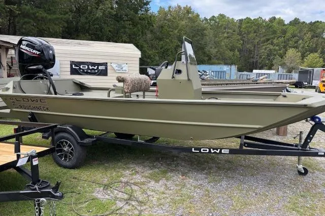 The Image of 2026 Lowe Roughneck 1760 Deluxe Tiller boat on trailer, outdoors, with Mercury engine. - 0