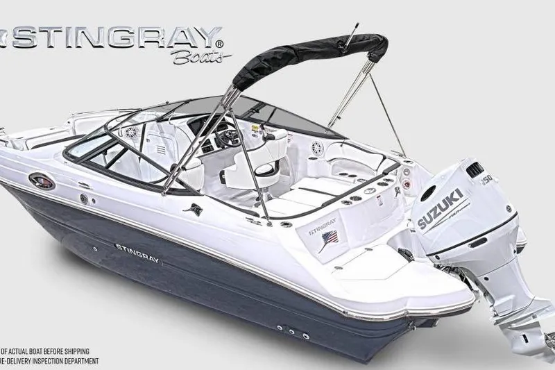 Slide: The Image of 2026 Stingray 211 DC boat with Suzuki outboard motor, sleek design, and spacious interior. - 3