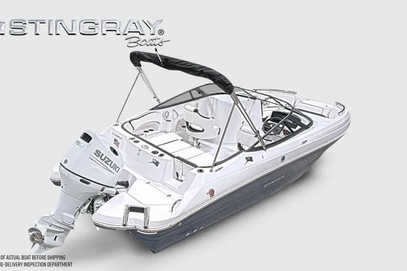 Slide: The Image of 2026 Stingray 211 DC boat with Suzuki outboard motor, sleek design, and spacious seating. - 6