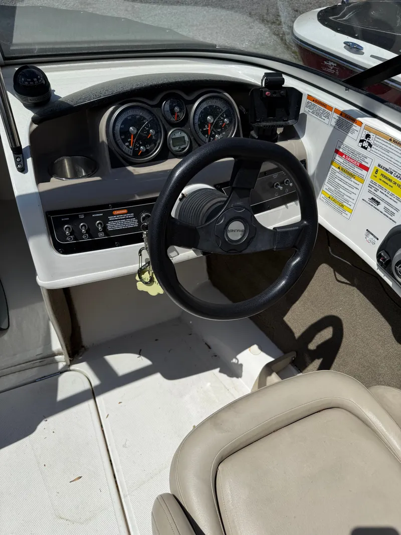 Slide: The Image of Interior view of 2015 Bayliner 185 boat cockpit. - 3