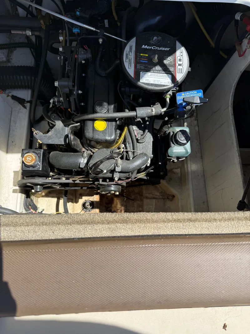 Slide: The Image of Engine compartment of a 2015 Bayliner 185 with MerCruiser engine. - 7