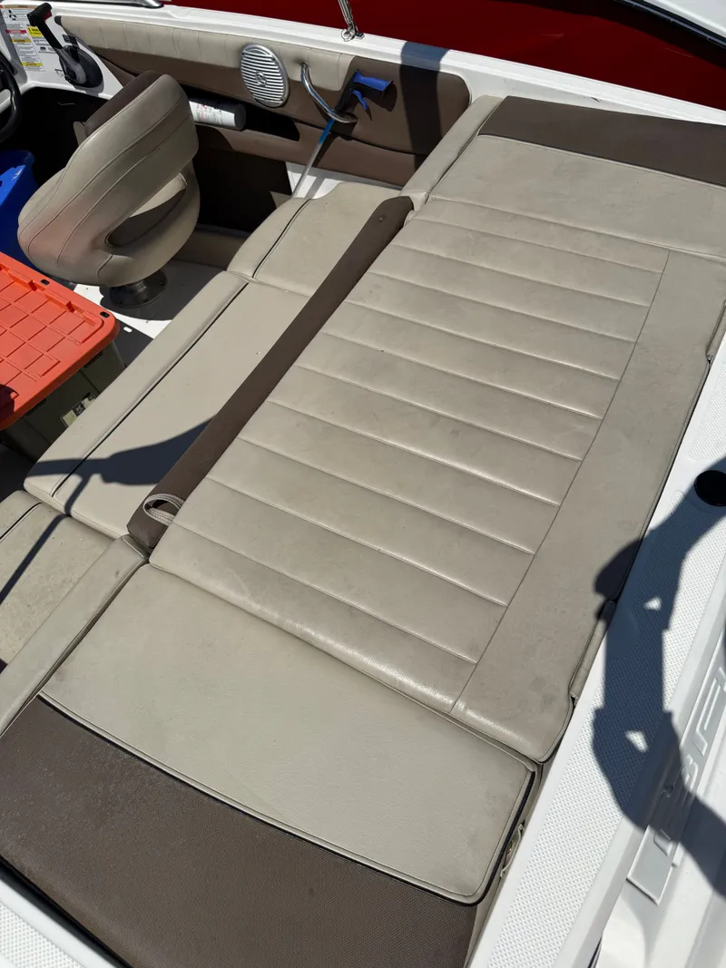Slide: The Image of Interior of a 2015 Bayliner 185 boat with beige upholstery. - 9