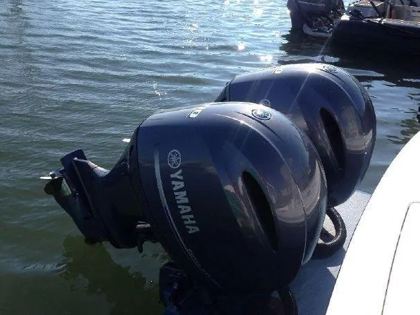 Slide: The Image of Two Yamaha outboard motors on a 2014 Regulator 25 boat. - 21