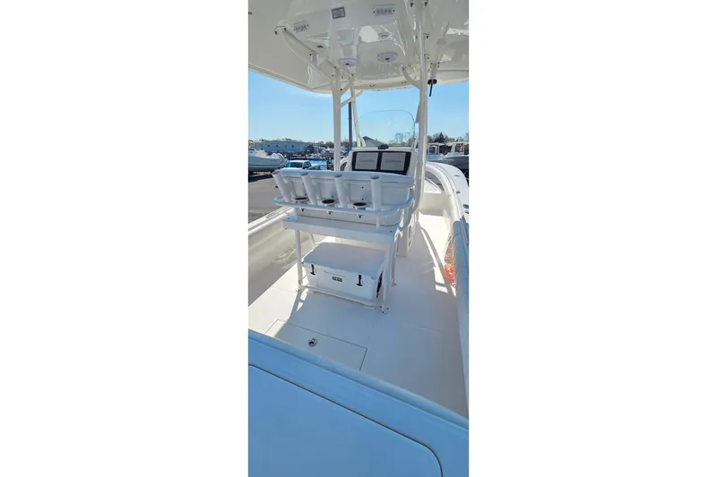 Slide: The Image of 2014 Regulator 25 boat interior with helm station and seating. - 8