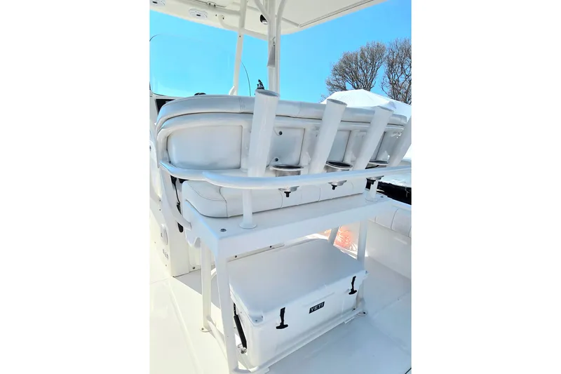Slide: The Image of 2014 Regulator 25 boat interior with seating and storage compartments. - 9