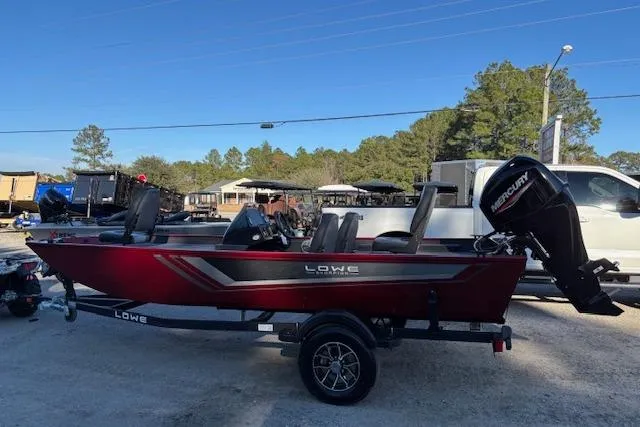 The Image of 2026 Lowe Skorpion 17 boat with Mercury engine, parked outdoors on a trailer. - 0