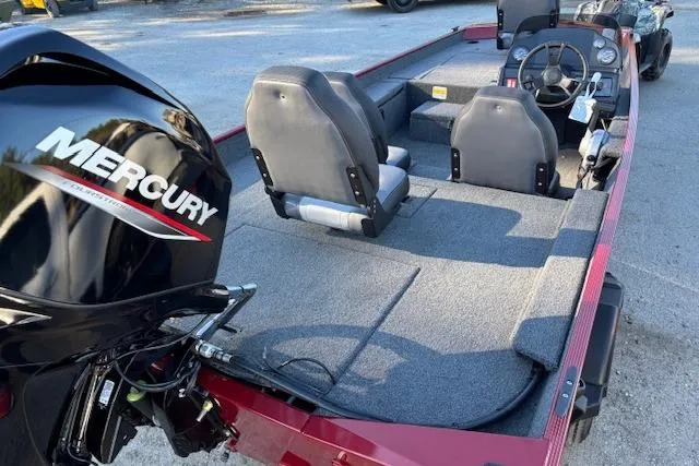 Slide: The Image of 2026 Lowe Skorpion 17 boat interior with Mercury engine, featuring dual seats and steering console. - 6