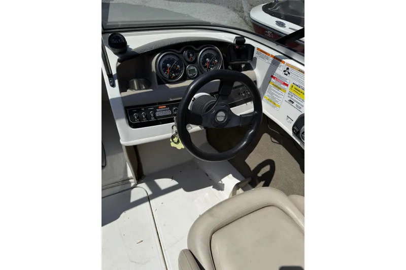 Slide: The Image of 2015 Bayliner 185 Bowrider dashboard with steering wheel and instrument panel. - 4