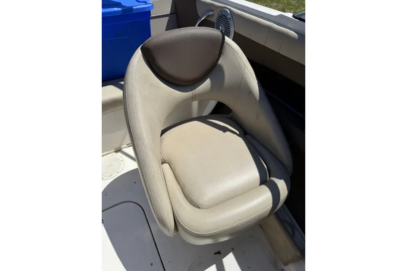 Slide: The Image of 2015 Bayliner 185 Bowrider boat seat, beige upholstery, sunny day. - 6