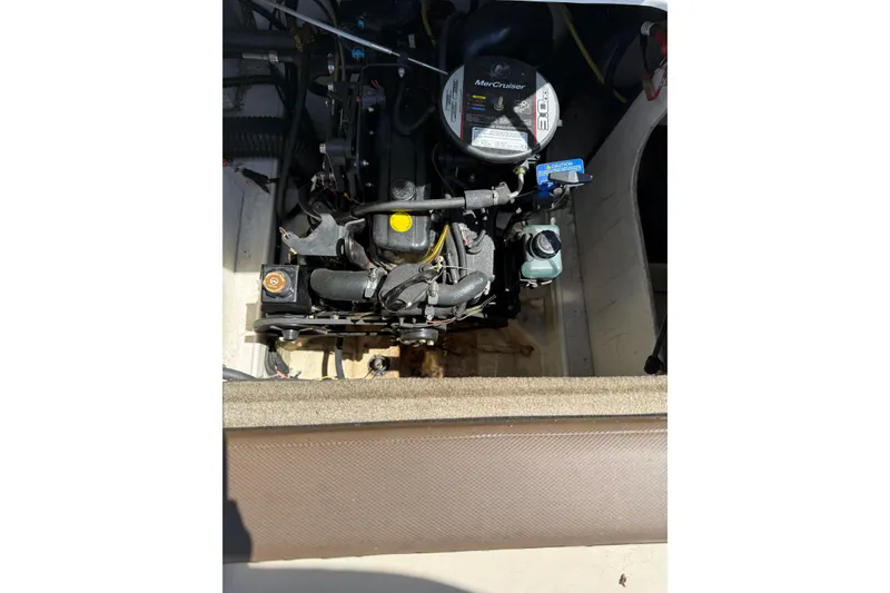 Slide: The Image of 2015 Bayliner 185 Bowrider engine compartment with MerCruiser 3.0L engine. - 8