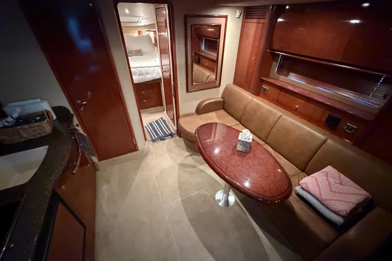 Slide: The Image of Luxurious interior of 2006 Sea Ray 40 Sundancer yacht with elegant seating and wooden finishes. - 10