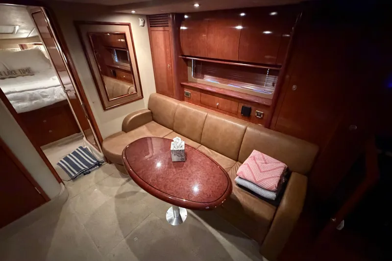 Slide: The Image of Luxurious interior of 2006 Sea Ray 40 Sundancer yacht with elegant seating and table. - 11
