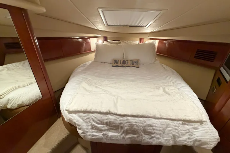 Slide: The Image of Luxurious cabin interior of 2006 Sea Ray 40 Sundancer yacht with cozy bedding. - 16