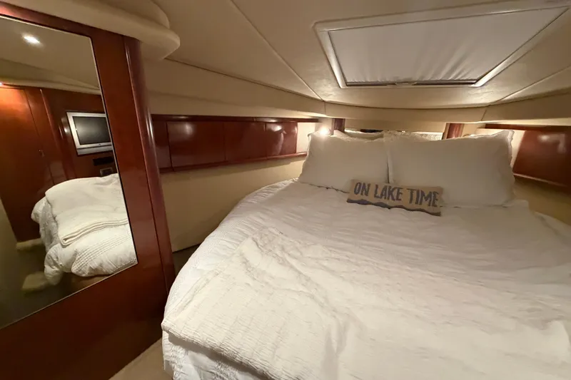 Slide: The Image of Luxurious cabin interior of 2006 Sea Ray 40 Sundancer yacht with cozy bedding. - 18
