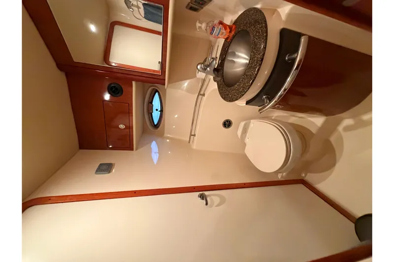 Slide: The Image of Bathroom interior of 2006 Sea Ray 40 Sundancer yacht, featuring sink and toilet. - 19