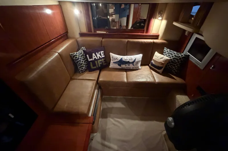 Slide: The Image of Luxurious 2006 Sea Ray 40 Sundancer interior with leather seating and decorative pillows. - 26