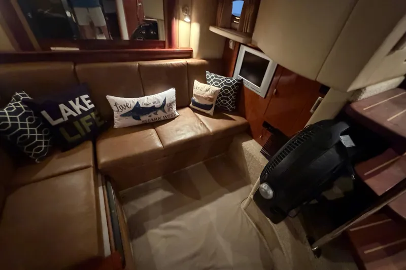 Slide: The Image of Interior of 2006 Sea Ray 40 Sundancer yacht with cozy seating and decorative pillows. - 27