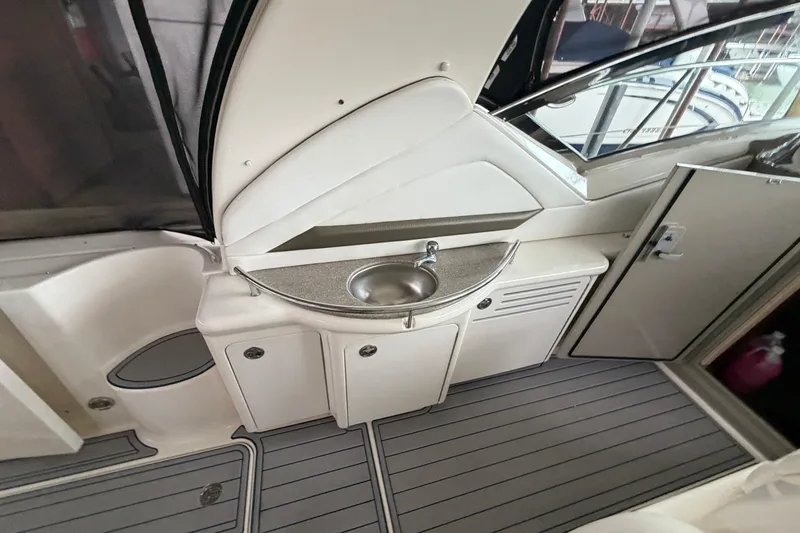 Slide: The Image of 2006 Sea Ray 40 Sundancer yacht interior with sink and storage cabinets. - 8