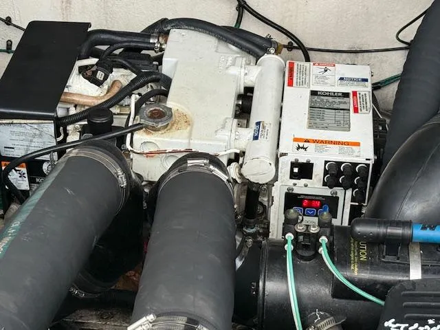 Slide: The Image of Engine compartment of a 2007 Sea Ray 320 Sundancer with visible Kohler generator. - 26