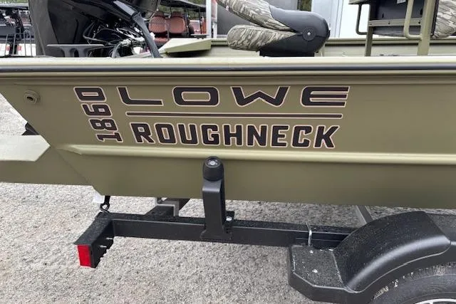 Slide: The Image of 2026 Lowe Roughneck RX1860 CC boat on trailer, showcasing model branding. - 2