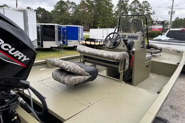 Slide: The Image of 2026 Lowe Roughneck RX1860 CC boat with Mercury engine, camo seats, and center console. - 4
