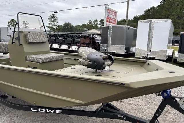 Slide: The Image of 2026 Lowe Roughneck RX1860 CC boat on trailer, displayed outdoors. - 6