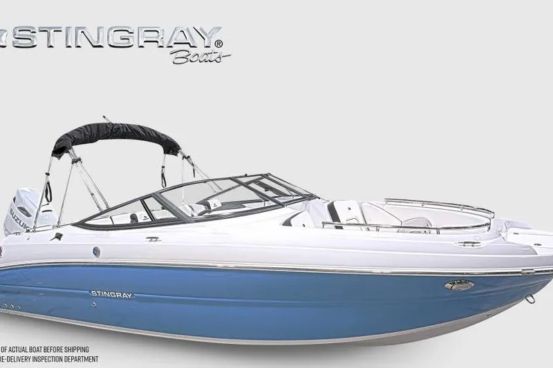 The Image of 2026 Stingray 231 DC boat with blue hull and sleek design. - 0