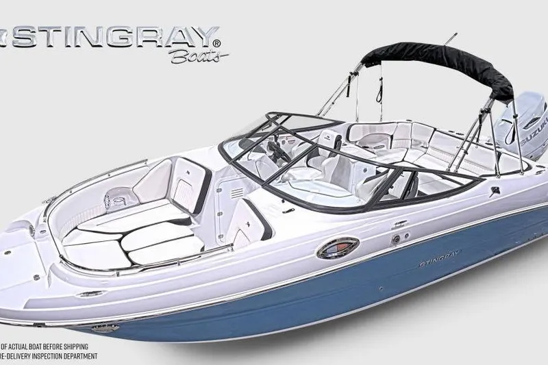 Slide: The Image of 2026 Stingray 231 DC boat with sleek design and spacious seating. - 2
