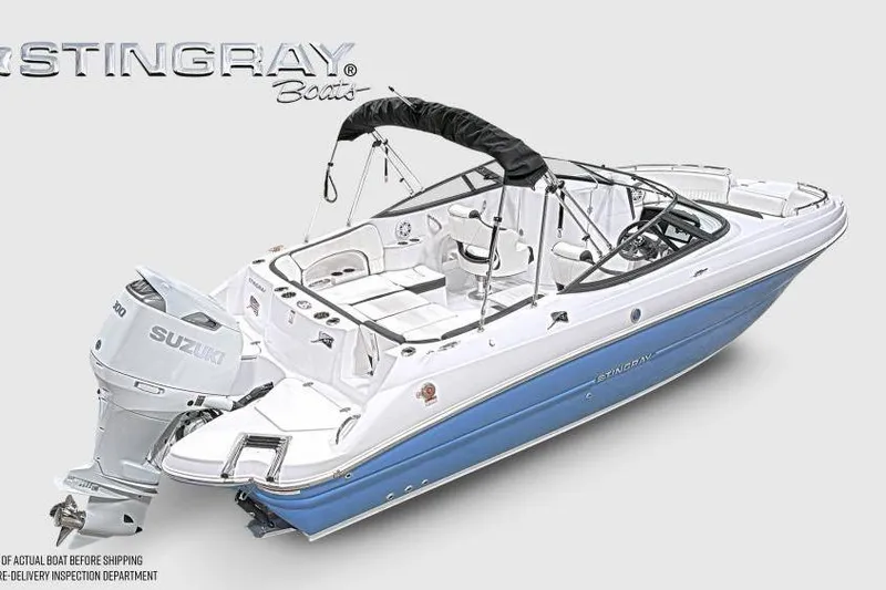 Slide: The Image of 2026 Stingray 231 DC boat with Suzuki outboard motor, featuring sleek design and spacious seating. - 6