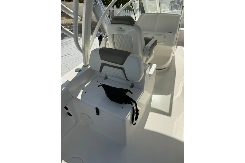 Slide: The Image of 2023 World Cat 255 DC boat interior with white seating and modern design. - 12
