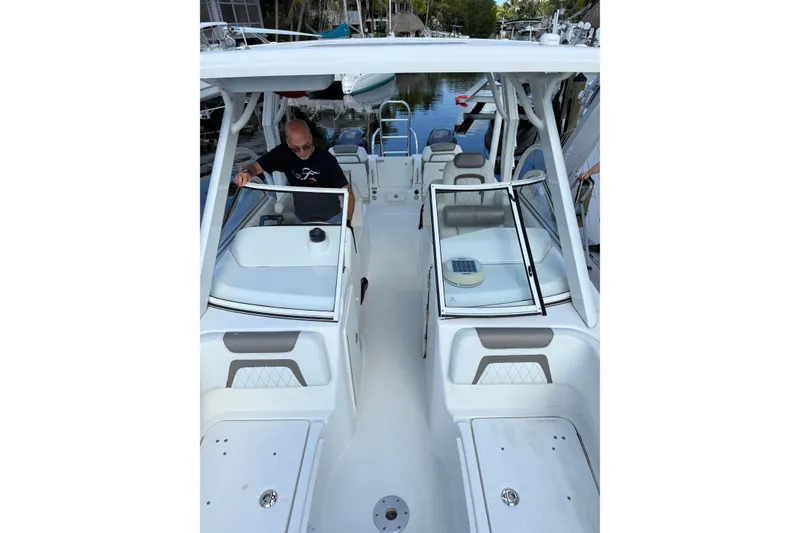 Slide: The Image of 2023 World Cat 255 DC boat interior with dual consoles and seating. - 18