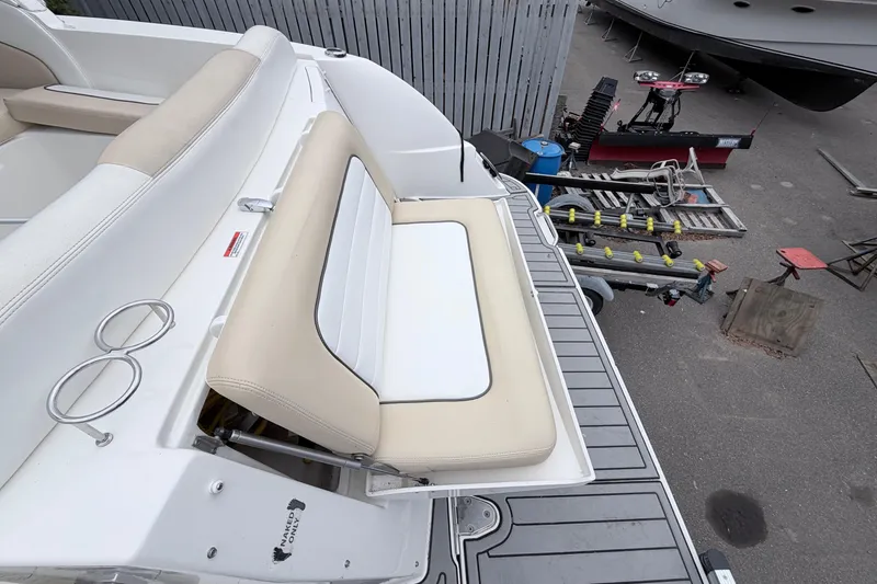 Slide: The Image of 2008 Sea Ray Sundancer 330 boat with beige and white seating on deck. - 1