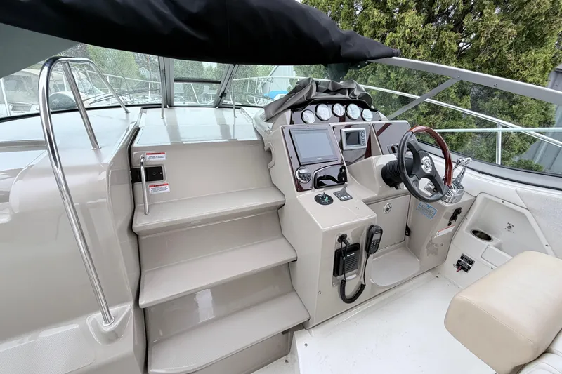 Slide: The Image of 2008 Sea Ray Sundancer 330 helm with modern controls and navigation equipment. - 10