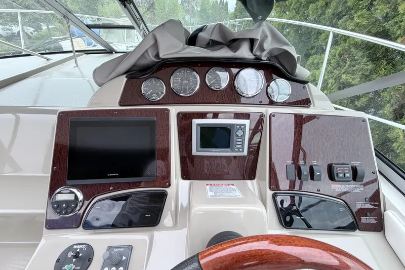 Slide: The Image of 2008 Sea Ray Sundancer 330 helm with navigation and control panels. - 18
