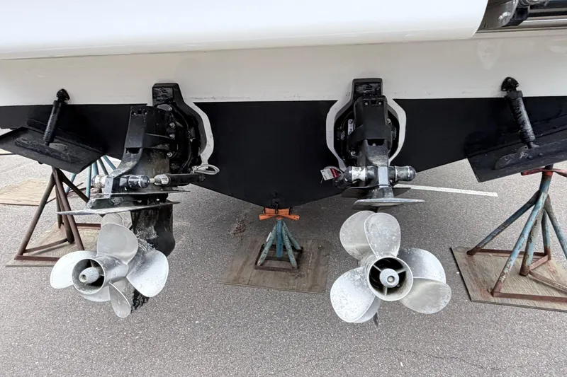 Slide: The Image of 2008 Sea Ray Sundancer 330 boat propellers on stands, showcasing dual outdrive system. - 34