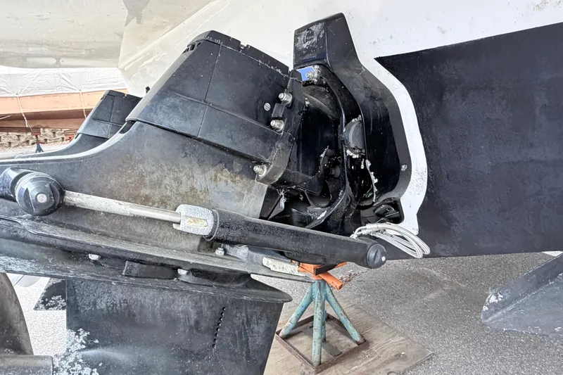Slide: The Image of 2008 Sea Ray Sundancer 330 outdrive detail on a boat stand. - 35
