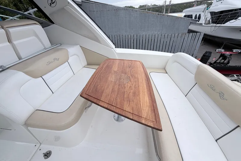 Slide: The Image of 2008 Sea Ray Sundancer 330 interior with wooden table and white seating. - 4