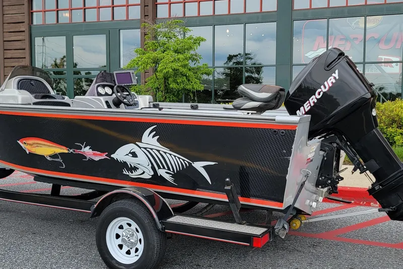 Slide: The Image of 2006 Tracker Targa 185 SC boat with fish skeleton graphic and Mercury outboard motor. - 3
