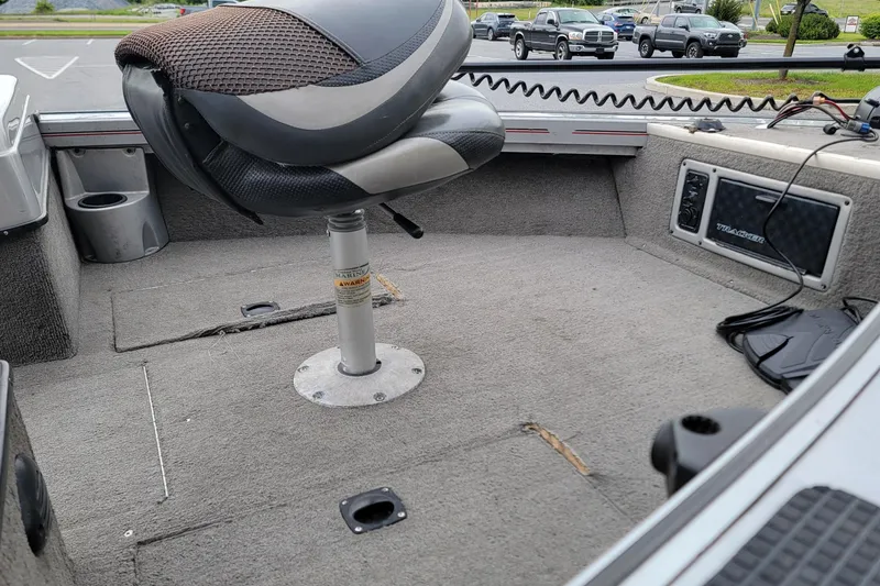 Slide: The Image of 2006 Tracker Targa 185 SC boat interior with swivel seat and carpeted deck. - 7