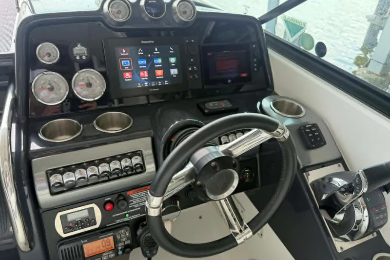 Slide: The Image of Cockpit of 2018 Formula 310 Sun Sport boat with modern controls and navigation system. - 10