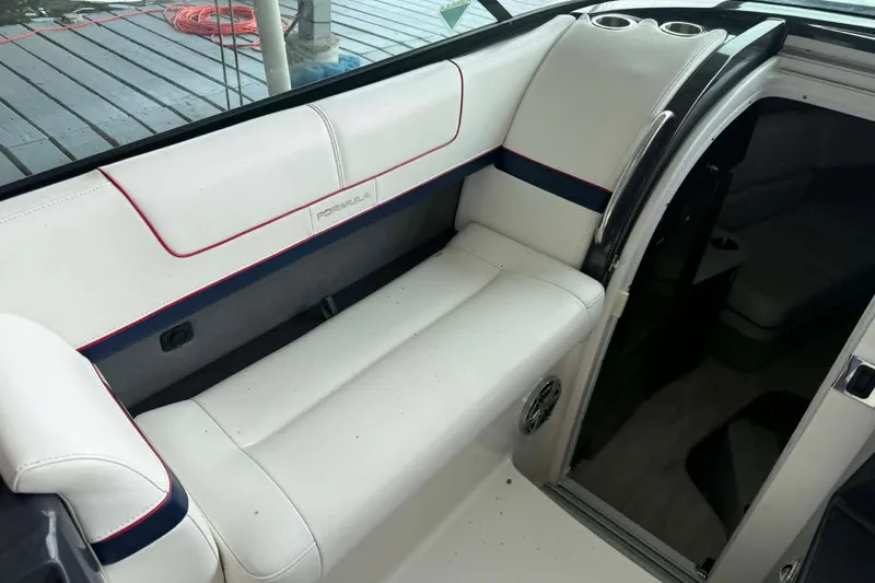 Slide: The Image of 2018 Formula 310 Sun Sport boat interior with white seating and cup holders. - 15